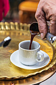 Africa, Egypt, Cairo. Egyptian coffee being served traditionally at a coffee shop in Cairo.