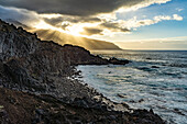 Sunbeams on the coast at La Maceta, El Hierro, Canary Islands, Spain