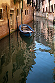 View of a boat in a canal in Venice, Dorsoduro, San Polo, Venezia, Veneto, Italy, Europe