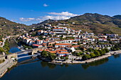 Aerial view of Douro river with city behind, Pinhão, Vila Real, Portugal, Europe
