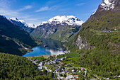 Aerial view of expedition cruise ship World Voyager (nicko cruises) in the Geiragerfjord seen from the nearby Flydalsjuvet viewpoint, Geiranger, Møre og Romsdal, Norway, Europe