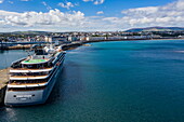 Aerial view of expedition cruise ship World Voyager (nicko cruises) at pier with town behind, Douglas, Isle of Man, British Crown Dependency, Europe