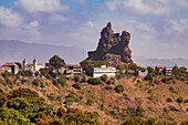 A lonely village with a church in front of a striking rock formation in the center of the island of Santiago, Cape Verde
