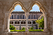 Ornate ornaments and arches on the window in the beautiful cloister of the Monastery of Alcobaca, Portugal