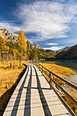 Wooden footbridge on the shore, Lake Anterselva, Riesenferner Group, South Tyrol, Italy