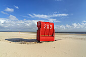 Red beach chair on the island of Borkum, Lower Saxony, Germany