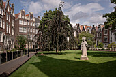 Courtyard with statue and typical architecture, Amsterdam, province of North Holland, The Netherlands, Europe