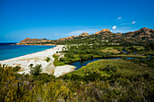 Sandy beach and mountains, Plage de lOstriconi, near LÎle-Rousse, Haute-Corse department, Corsica, Mediterranean Sea, France