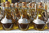 Olive oil at the Saturday market in Pernes-les-Fontaines, Vaucluse, Provence-Alpes-Côte d'Azur, France