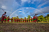 A full rainbow graces a cultural performance by the Naga tribe for passengers on the Anawrahta (Heritage Line) river cruise ship, Homalin, Sagaing Region, Myanmar, Asia