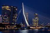 Erasmus Bridge (Erasmusbrug) over Nieuwe Maas and modern buildings at night, Rotterdam, South Holland, The Netherlands, Europe