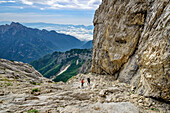 Two people climb through steep Schrofenwand, Feltriner Berge, Belluneser Höhenweg, Dolomites, Veneto, Venetia, Italy