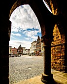 View through an arcade in the arcade of the old town hall to the market square, Minden, North Rhine-Westphalia, Germany