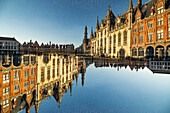 Double exposure of a large gothic building on the main square, Grote Markt, in Bruges, Belgium.
