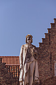 Statue of a medieval merchant from Bruges, Belgium.