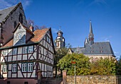 Half-timbered house with St. Mark's Church in Butzbach, Wetterau, Hesse, Germany