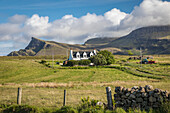 Secluded cottage on the north of the Trotternish Peninsula, Isle of Skye, Highlands, Scotland, UK