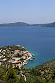 Fishing village of Steni Vala on the east coast of Alonissos island, with Perista island in the background, Northern Sporades, Greece
