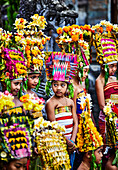 Female children dressed up for the festival of Kuningan in the Karangasem Regency of Bali Indonesia.