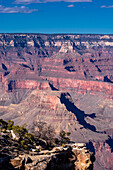 The Grand Canyon as seen from the South Rim in Arizona. The large gorge was eroded over millions of years by weather and the Colorado river that still runs through it. The reddish tint it has is due to the iron contained in the rock's minerals that oxide.