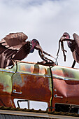 Vulture sculpture made of board metal.