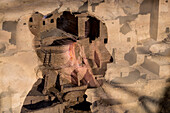 Double exposure portrait of a woman and desert dwellings in the Southwest USA..