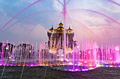 Colorfully illuminated fountain at Patuxai Victory Gate at dusk, Vientiane capital, Laos, Asia