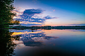 Rahmer See at sunset and reflection of the clouds in the water, Mühlenbecker Land, Brandenburg, Germany