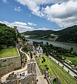 Reichenstein Castle: View over the outer bailey, the tournament area and the castle hotel, in the background the Königstein watchtower and the Rhine Valley near Trechtingshausen, Upper Middle Rhine Valley, Rhineland-Palatinate, Germany