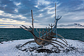 The Sun Voyager at sunset on Saebraut Road in iceland