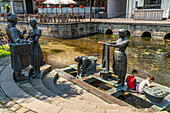 Sculpture washerwomen at the Warmen Pader in Paderborn, North Rhine-Westphalia, Germany, Europe