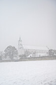 Monastery church in Oberelchingen during a snowstorm, Neu-Um district, Swabian Jura, Bavaria, Germany, Europe