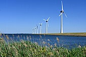 Wind farm and dykes at Urk on the IJsselmeer, Netherlands