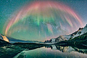 Northern lights and Milky Way over the Devil's Teeth and the Ersfjord, Okshornan, Tungeneset, Senja, Troms og Finnmark, Norway