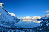 Mountains are reflected in Nordfjord, Bergsbotn, Senja, Troms og Finnmark, Norway