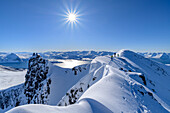Three people on a ski tour ascend Husfjellet, Husfjellet, Senja, Troms og Finnmark, Norway