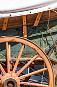 Detail of a antique wooden carriage in Santa Fe, New Mexico.