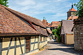 Alley with historical buildings in Rothenburg ob der Tauber, Middle Franconia, Bavaria, Germany