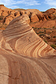 Curved lines in the rock of Fire Wave rock formation in Valley of Fire State Park.