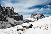 Snow-covered mountains and alpine hut, winter, Val Gardena, Val Gardena, Dolomites, South Tyrol, Italy