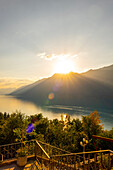 The Historical Grandhotel Giessbach with View over Mountain and Lake Brienz in Sunset in Bern Canton, Switzerland.