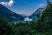 View over Lake Lungern and Village with Mountain in a Sunny Day in Lungern, Obvaldo, Switzerland.