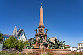 The Mendebrunnen and the modern Augusteum of the University of Leipzig on Augustusplatz, Leipzig, Saxony, Germany