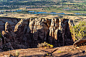 Dusk light illuminates the monumnets in Monument Canyon in Colorado National Monument