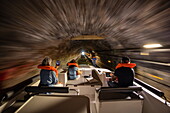 Crew with life jackets on board a Le Boat Horizon 5 houseboat traveling through tunnels on the Canal de la Marne au Rhin, Saint-Louis, Moselle, France