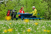 Man and woman cycling take a break at a rest area, Loire cycle path, Loire castles, Loire Valley, UNESCO World Heritage Loire Valley, France