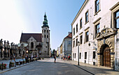 Grodzka Street with statues of the twelve apostles of the Church of St. Peter and Paul (kościół św. Piotra i Pawła), Church of St. Andrew (Kościół św. Andrzeja) and the palace building of the Collegium Iuridicum in the Old Town of Kraków in Poland