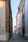 Alley Ulica Gołębia (Golebia) with the Collegiate Basilica of Mary Magdalene (Church of St. Stanislaus and St. Mary Magdalene, Kościół Farny św. Stanisława, Kosciol Farny Sw. Stanislawa) in Poznań (Poznan; Poznan) in the Wielkopolska Voivodeship of Poland