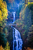 Giessbach Falls in autumn light; Switzerland, Canton of Bern, Bernese Oberland