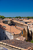 Red clay tile rooftops of Arles, France.